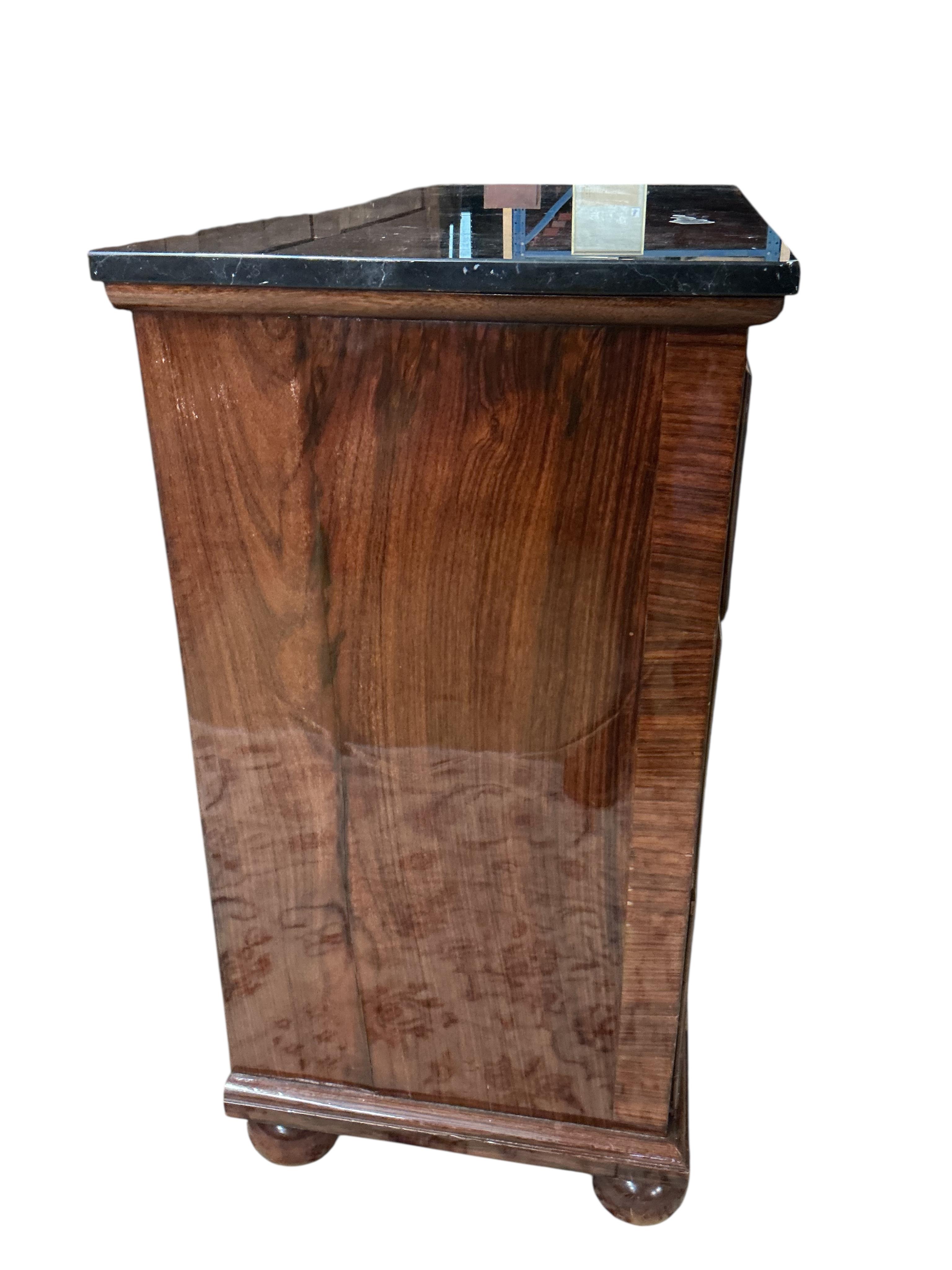 An 18th century and later rosewood veneered chest with associated reconstituted black marble top, width 106cm, depth 46cm, height 88cm